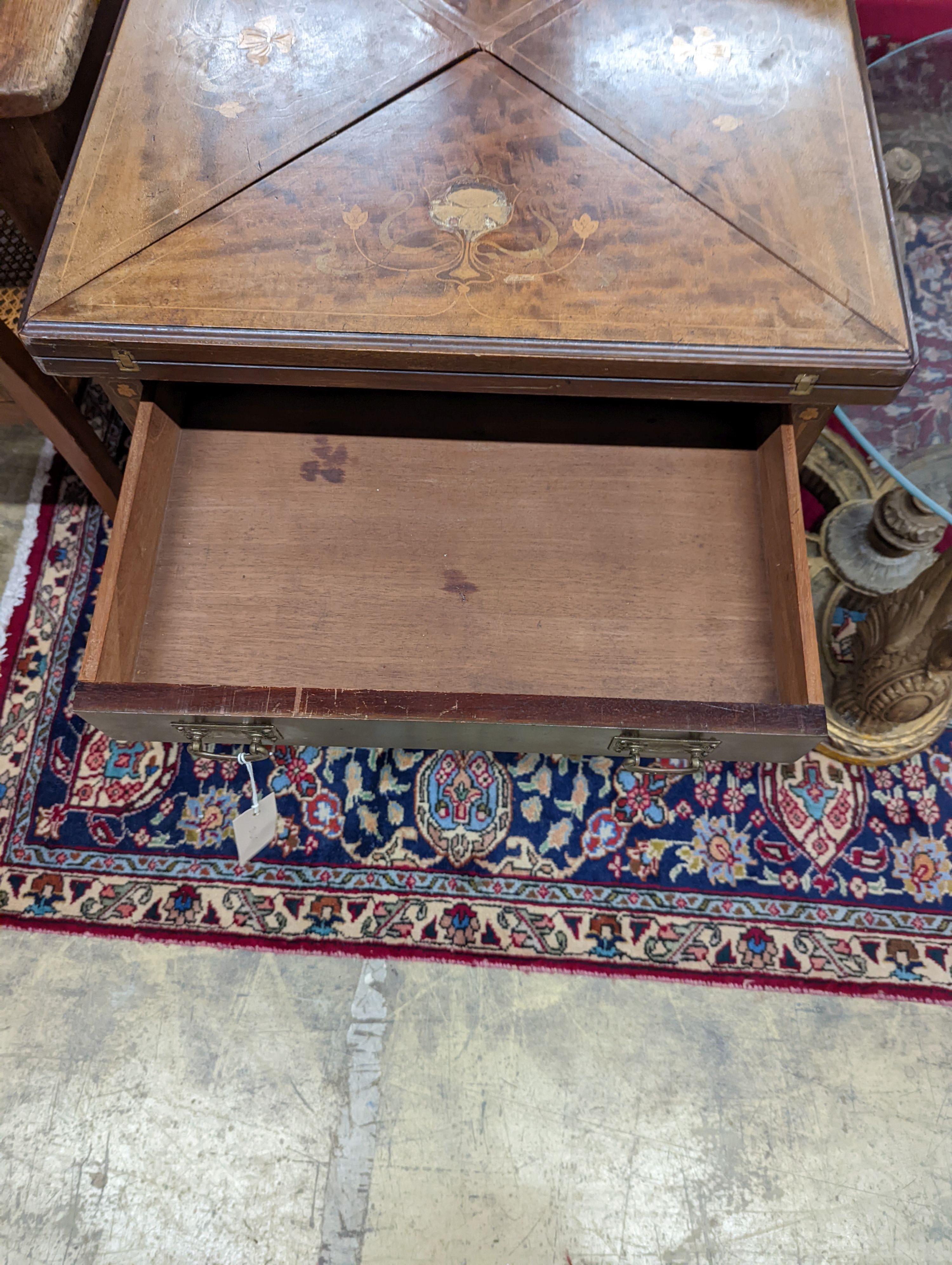 An Edwardian Art Nouveau mahogany and marquetry envelope card table. W-56, D-56cm, H-73cm.